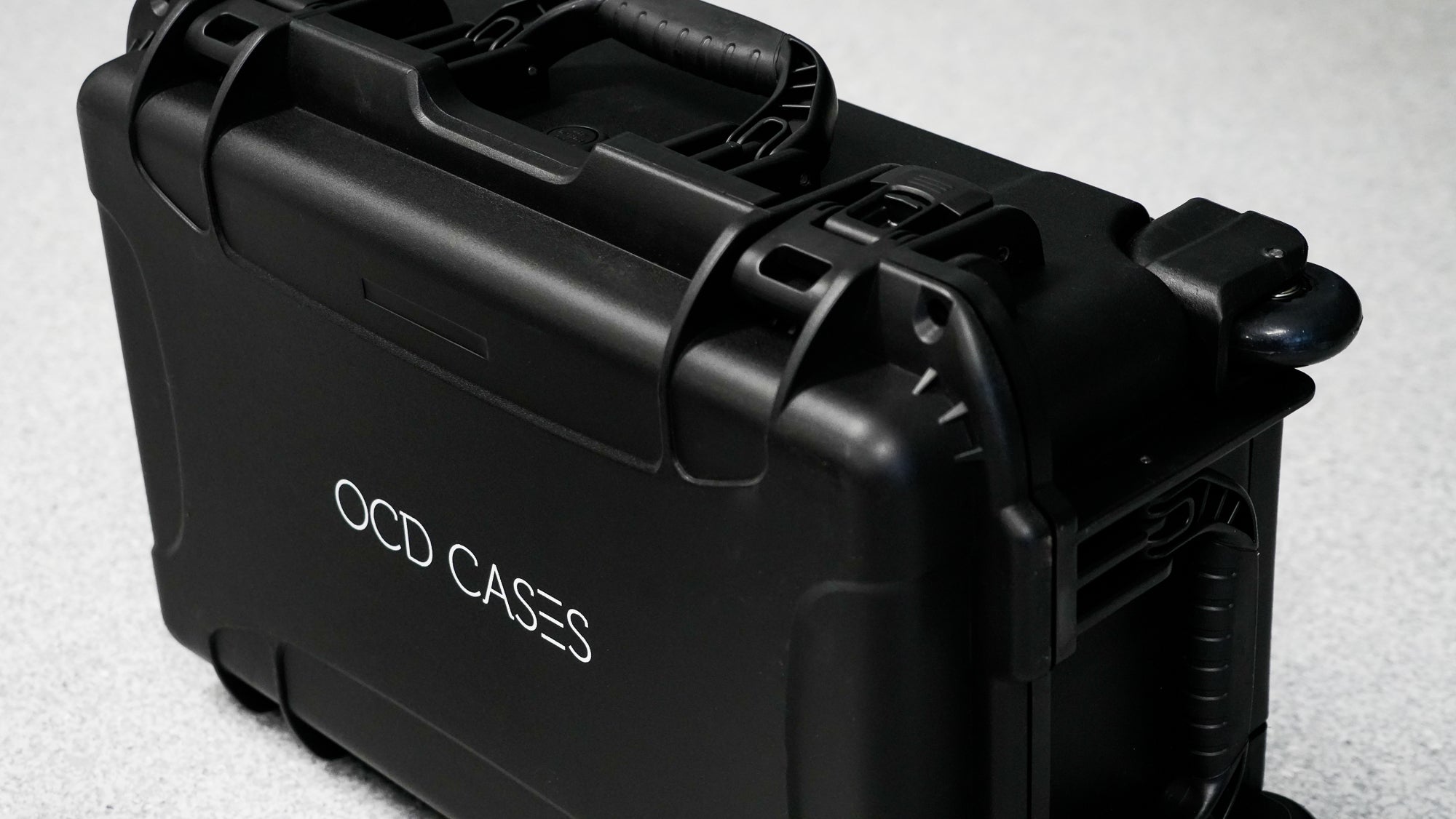 black protective hard case with "OCD CASES" logo on the front