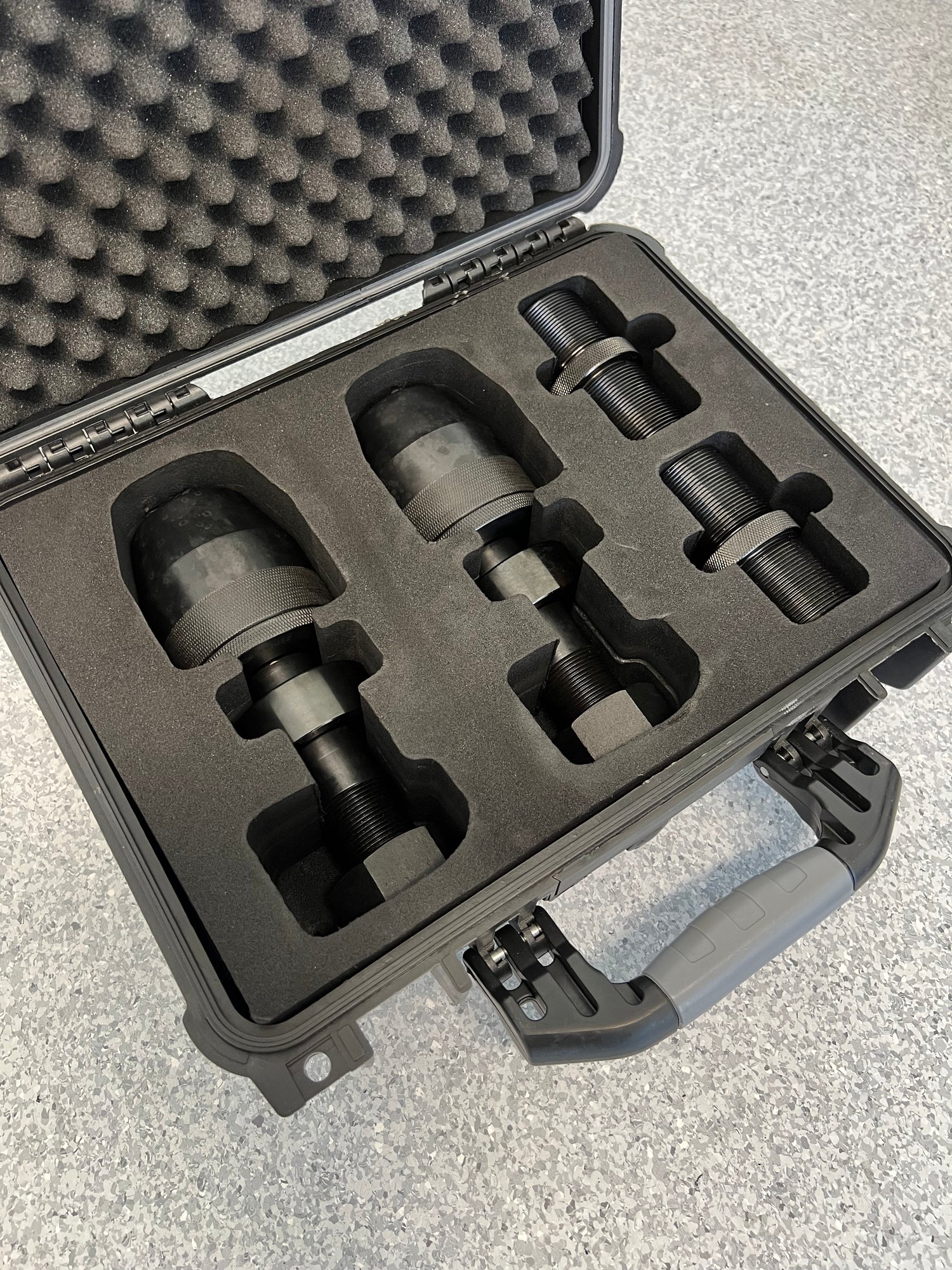 tensioning device in a protective case, secured in a custom foam insert
